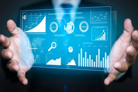 A screen with a dashboard held by a business man